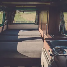 white vehicle related to The Convenience of Roll Away Beds: Space-Saving Solutions for Any Room