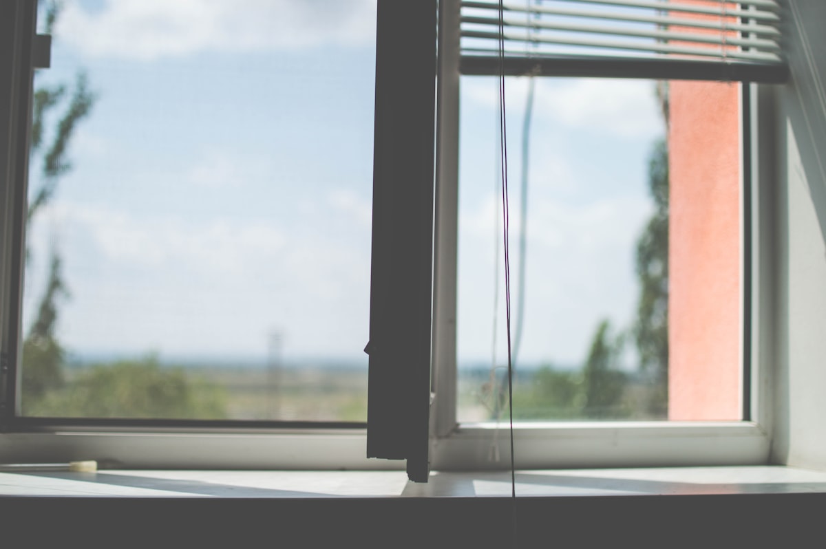 white window blinds on window related to Elevate Your Windows with Ready-Made Valances