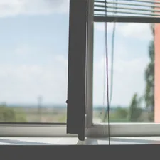 white window blinds on window related to Elevate Your Windows with Ready-Made Valances