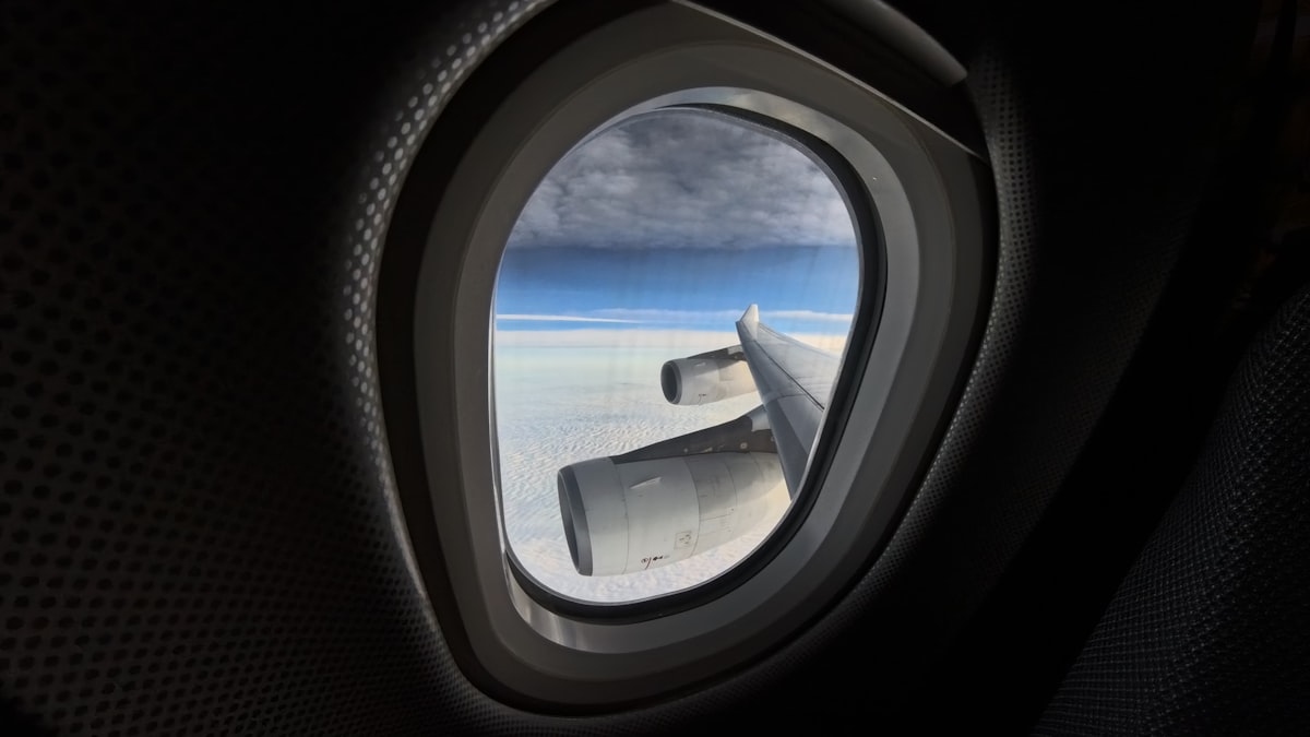 Wide angle shot of an airplane window related to Valances for Wide Windows: Perfecting Your View