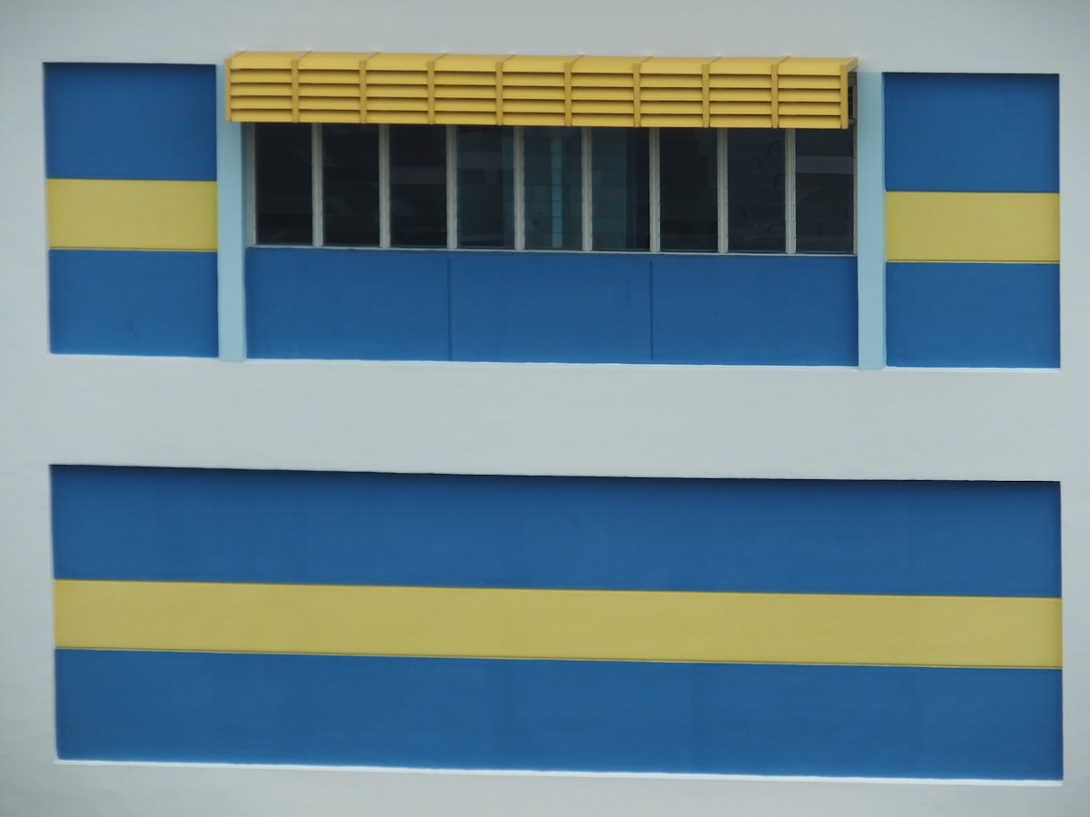 Window Painted yellow and blue related to A Comprehensive Guide to Window Blind Valance Clips