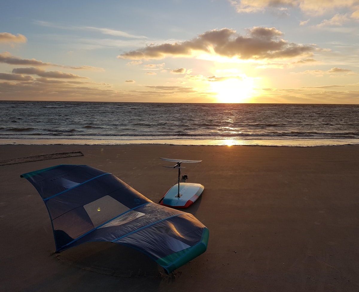 Wingfoil gear in the sunset after a great session.

Visit wingfoil.com for more wing foiling and wing surfing photos and videos. related to Sandy Snooze: The Ultimate Guide to Inflatable Beach Beds
