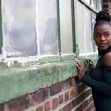 woman holding wall related to Unlock the Beauty of Your Windows: A Guide to Window Valance Boxes