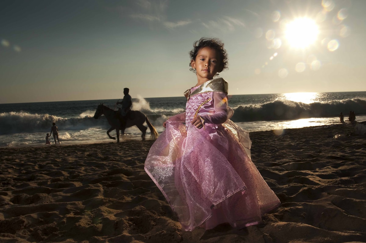 woman in purple dress standing on beach during daytime related to Magical Dreams: Princess Toddler Bed Set