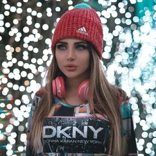 woman in red beanie related to Discover the Cozy World of DKNY Coverlets and Quilts