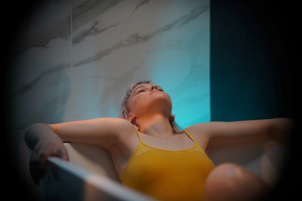 woman in yellow bikini top related to The Ultimate Guide to Choosing the Right Tanning Bed Bulbs