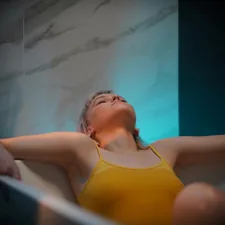 woman in yellow bikini top related to The Ultimate Guide to Choosing the Right Tanning Bed Bulbs