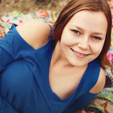 woman lying on textile related to Top Teen Bed Spreads: Trendy Choices for Every Teen's Room