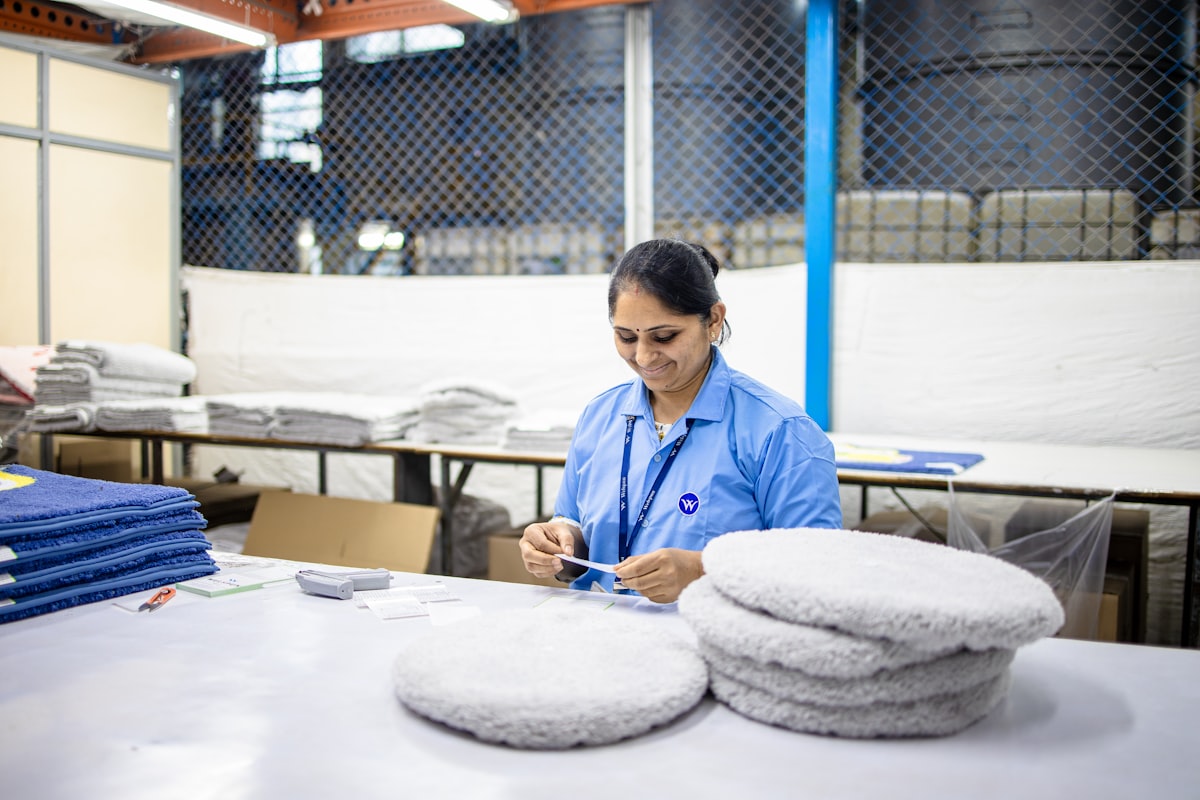 Woman sorts items at a factory workstation. related to Unleashing the Secrets of Bed Body Works: A Comprehensive Guide