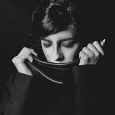 woman standing wearing black sweater related to Elegant and Timeless: The Black and White Toile Valance