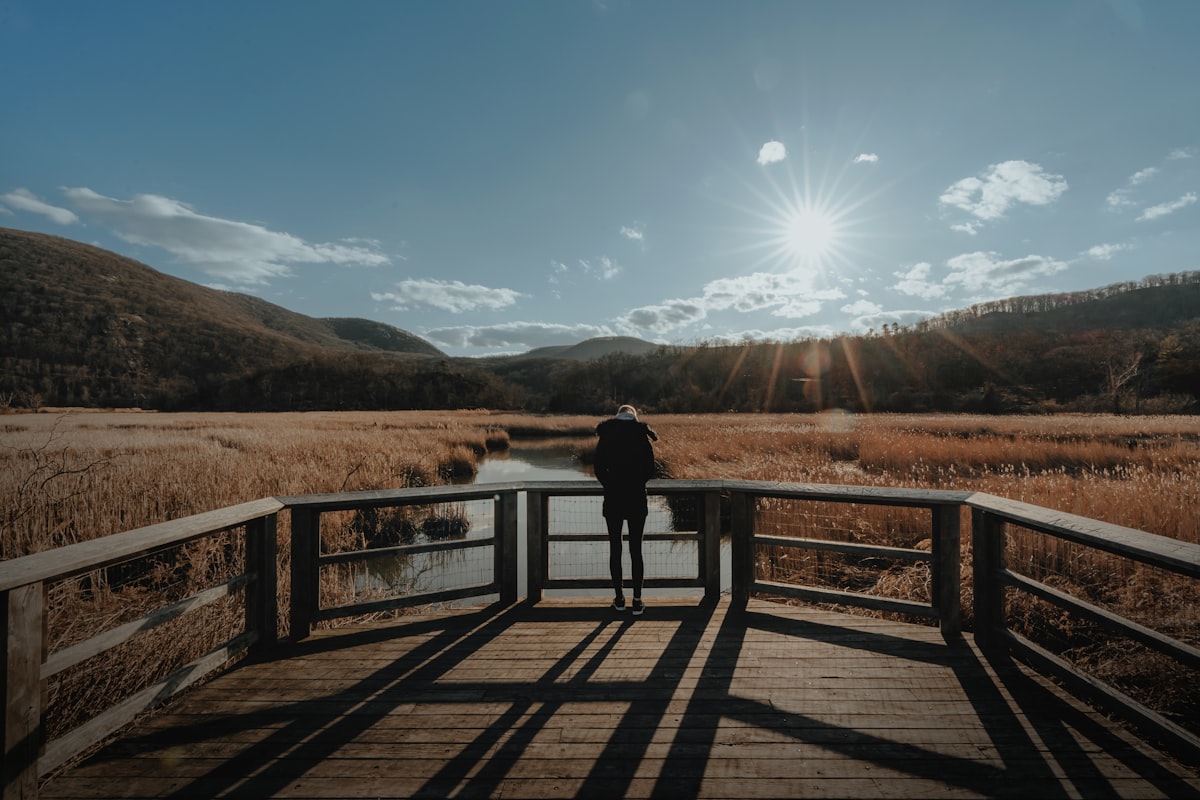Woman staring into the valley (IG: @clay.banks) related to Cozy Haven in the Hudson Valley: A Review of New Paltz Bed and Breakfast