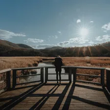 Woman staring into the valley (IG: @clay.banks) related to Cozy Haven in the Hudson Valley: A Review of New Paltz Bed and Breakfast