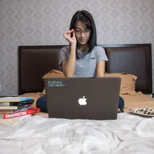 Woman using laptop in bed (Model Syvi Melodi Oktavia.) related to Girls in Bed