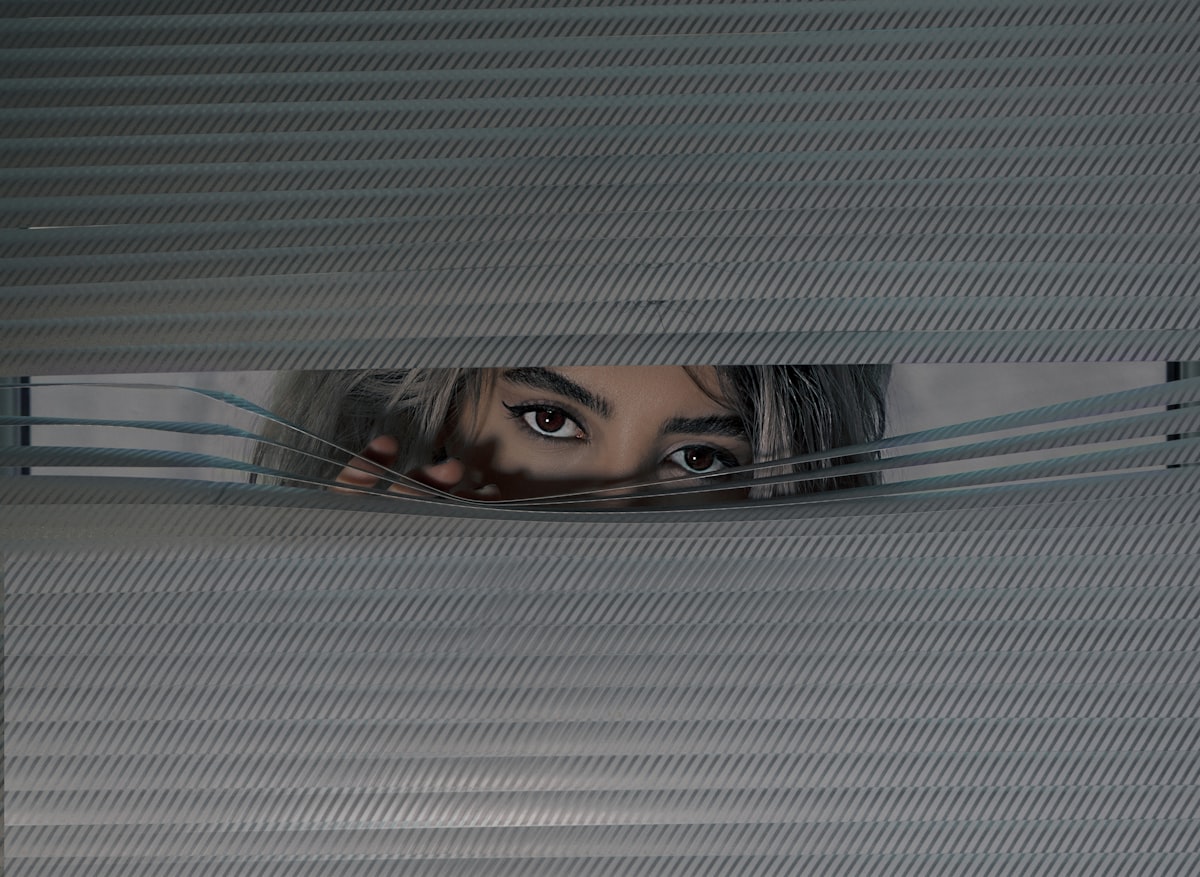 womans face on screen related to Window Valances: Elevate Your Interior Style