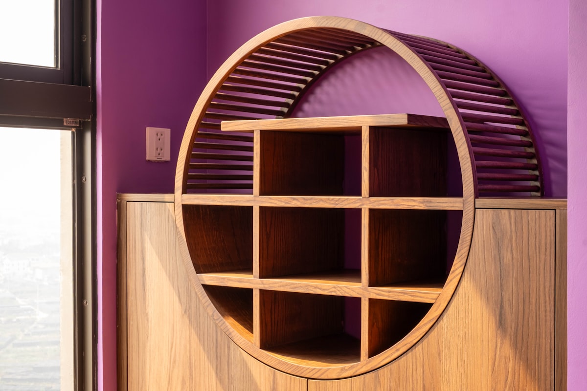 Wooden shelving unit with a unique, circular design. related to Elevate Your Dining Experience with a Majestic Sideboard Buffet with Wine Rack