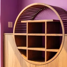 Wooden shelving unit with a unique, circular design. related to Elevate Your Dining Experience with a Majestic Sideboard Buffet with Wine Rack