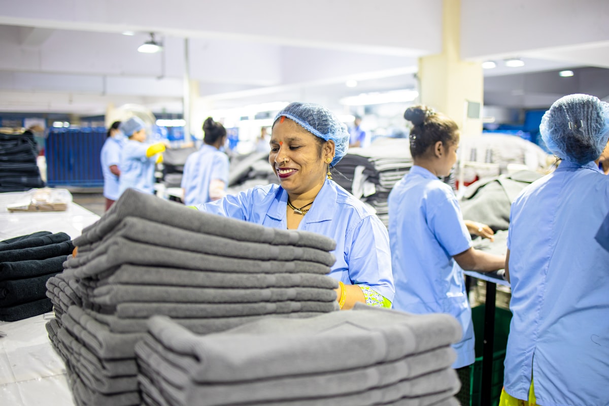 Workers sort towels in a factory. related to Thriving Careers at Bed Bath & Beyond: Your Path to Success