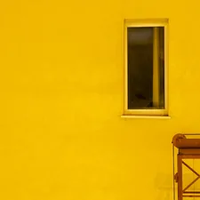 yellow painted house with window related to Elevate Your Windows with Yellow and Grey Valances